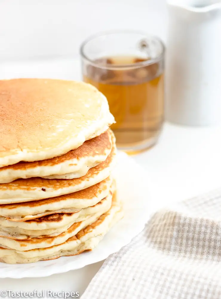 Side shot of a stack of buttermilk pancakes