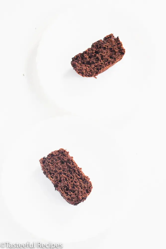 Angled shot of two slices of vegan chocolate loaf cake