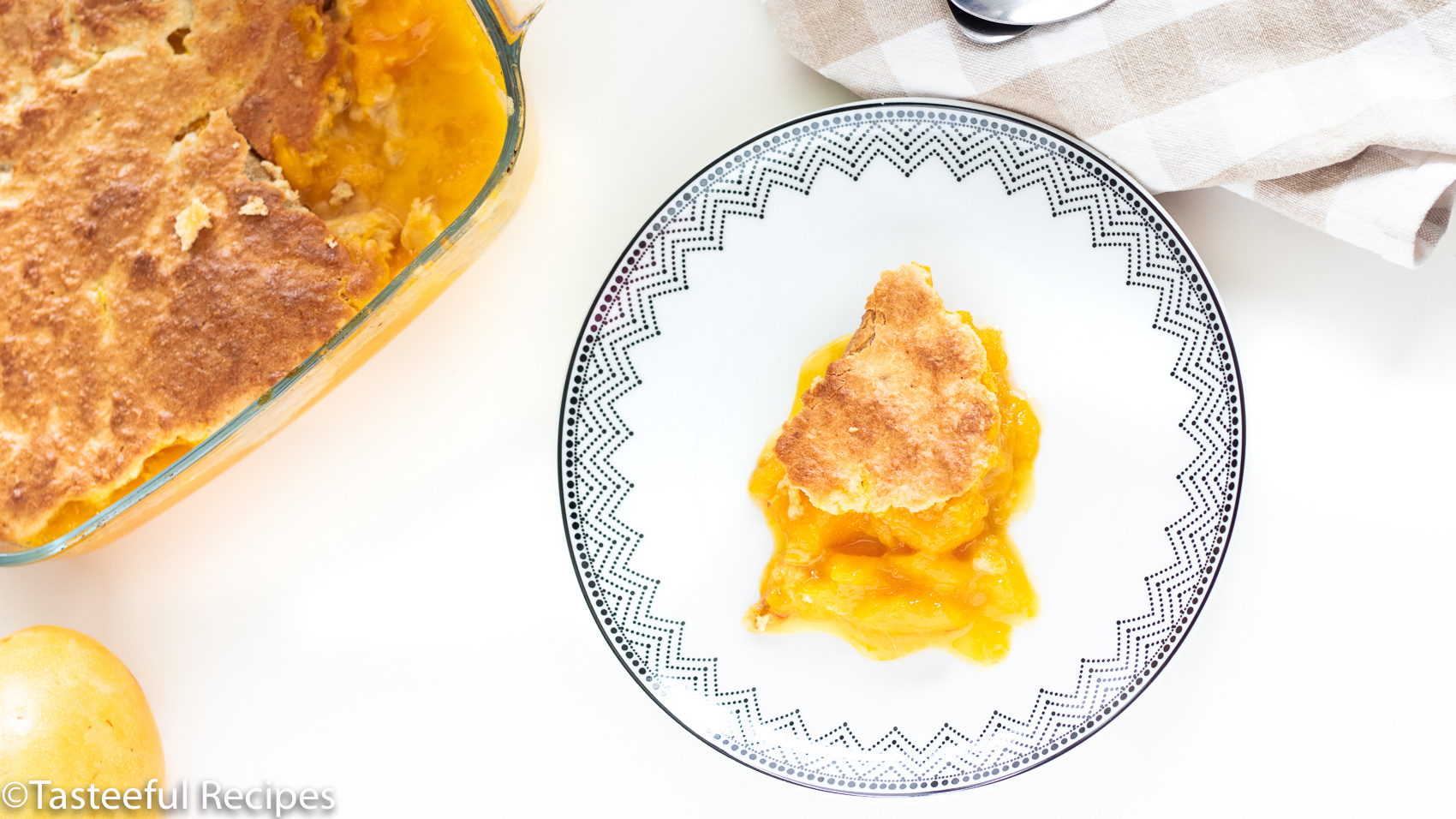 Overhead shot of coconut mango cobbler on a plateOverhead shot of coconut mango cobbler on a plate